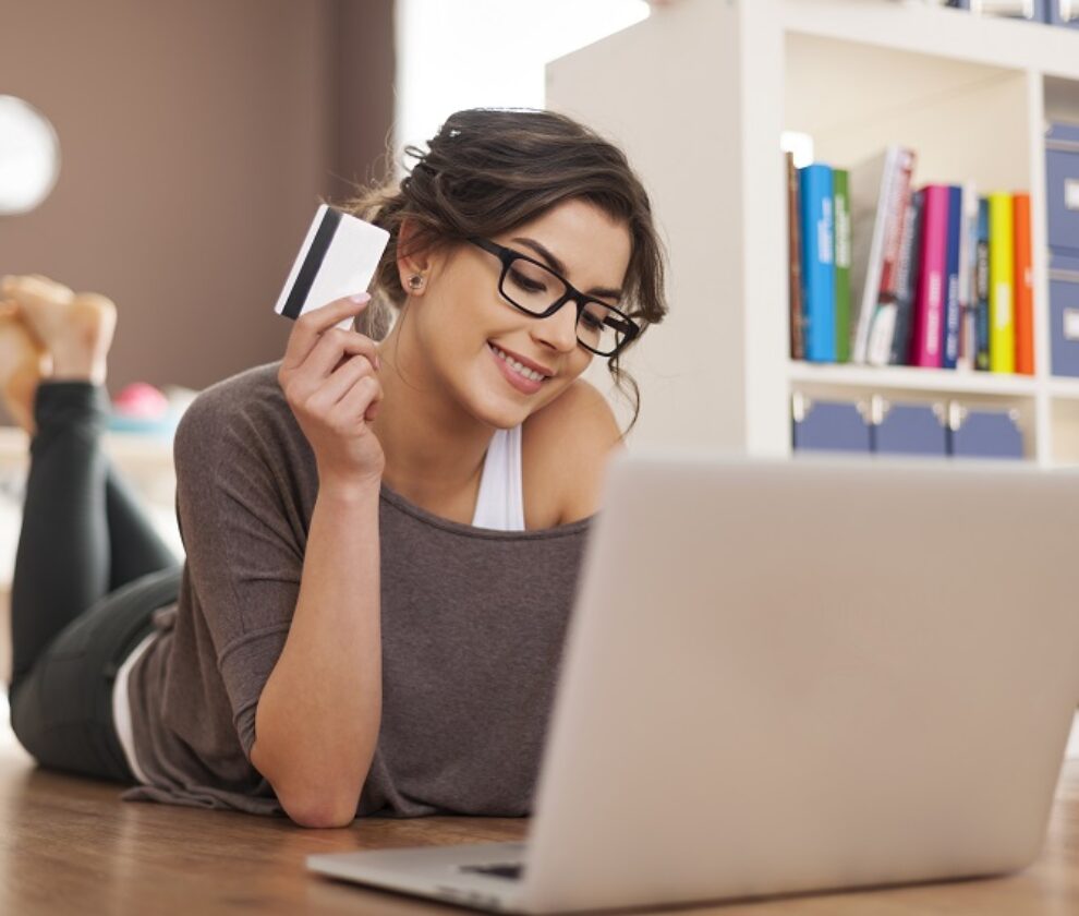 Happy woman doing online shopping at home